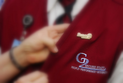 "Super Service" pin displayed on employee